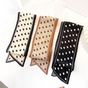 Three pleated polka dot scarves in cream, coffee, and black for hair and neck styling