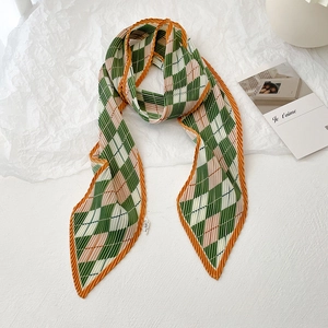 French style pleated skinny scarf with green and orange diamond pattern on white background