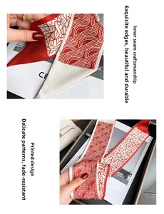 Détail d'un twilly en soie rouge aux motifs géométriques avec couture interne et imprimé durable