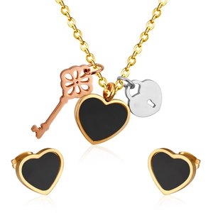 Three-tone stainless steel jewelry set featuring heart, key and lock pendants on white background