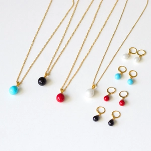 Golden teardrop shell bead necklace and hoop earrings set in four vibrant colors