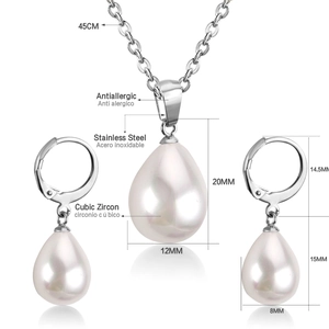 Macro view of teardrop pearl necklace and earring set with cubic zirconia details