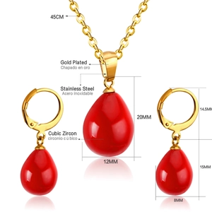 Detail view of red teardrop zircon necklace and earrings set in gold plated stainless steel