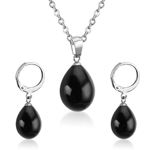 Close-up of polished black water-drop pendant necklace and matching leverback earrings