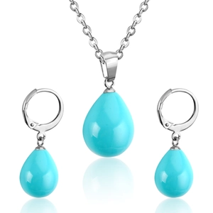 Detail of teardrop sky blue shell pendants with silver stainless steel chain and earrings