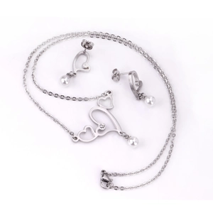 Detail of silver heart jewelry set with white pearls and sparkling zircon stones