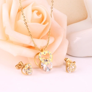 Fashion heart pendant necklace and earrings set with sparkling stones in gold finish