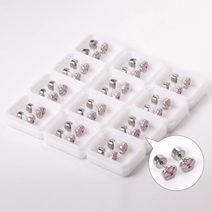 Set of 12 pairs of mini silver flower stud earrings in white individual storage boxes