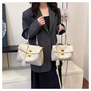 Comparison view of cream leather tote bags in large and small sizes with gold locks