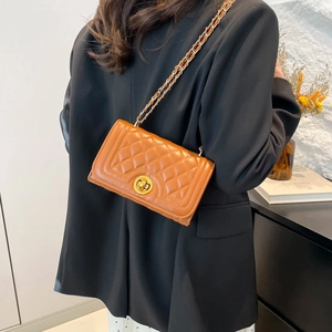 Retro brown quilted shoulder bag with gold chain strap and circular twist lock closure