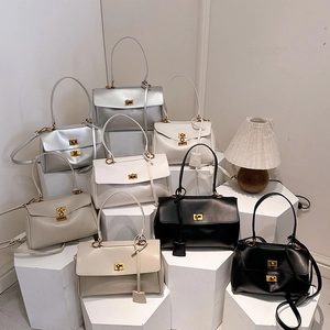 Minimalist faux leather tote bags with gold metal twist locks in various chic colors