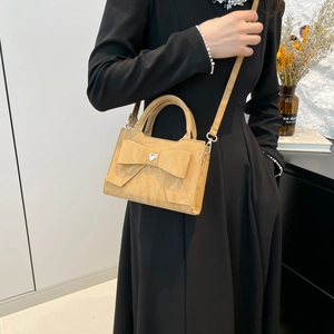 Elegant yellow bow handbag with heart rhinestone and adjustable crossbody strap