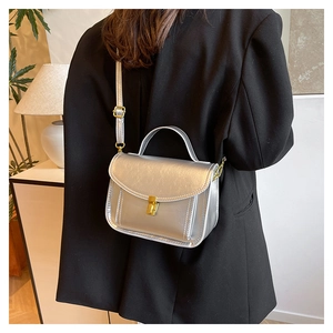 Silver PU leather handbag with fine crinkle texture and gold metal clasp detail
