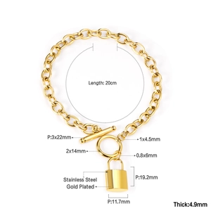 Detail view of 18K gold plated stainless steel bracelet with OT toggle and lock pendant