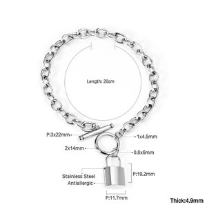 Detail view of silver stainless steel chain bracelet with heart lock pendant and OT toggle clasp