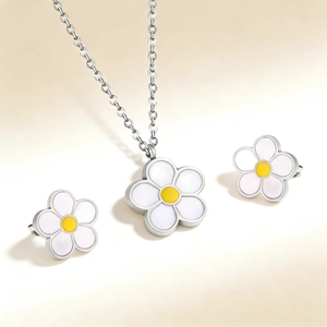 Parure de bijoux marguerite avec collier et boucles d'oreilles sur fond dégradé doux