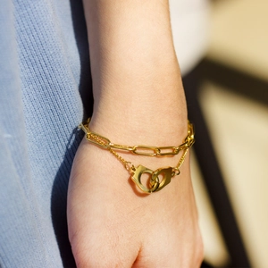 18K gold plated double layer paperclip chain bracelet with interlocking handcuff pendants