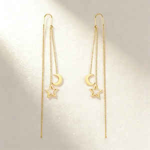 Élégantes boucles d'oreilles pendantes dorées avec pendentifs étoile et lune style luxe