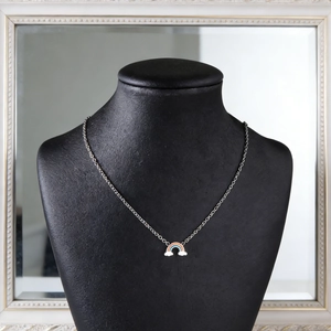 Rainbow enamel pendant necklace with white cloud detail on a silver stainless steel chain