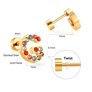 Detail view of G-letter gold plated stainless steel stud earring with colorful crystals
