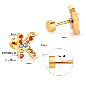 Detailed macro view of gold plated 'K' initial stud with colorful mixed crystals