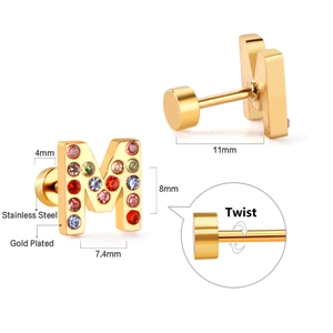 Detail of letter M stainless steel stud earring with colorful crystals and twist back