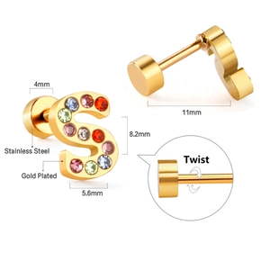 Detailed macro view of S-letter gold plated stainless steel stud with multi-color crystals
