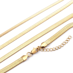Detail view of four different widths of gold herringbone chains with lobster clasp