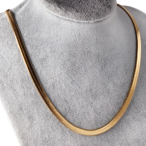 Flat gold herringbone snake chain necklace displayed on a jewelry bust stand