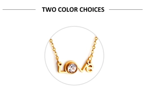 Detailed macro view of gold-plated Love pendant with sparkling white cubic zirconia