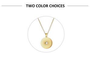 Macro detail of golden sunburst pendant necklace with a clear cubic zirconia stone