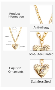 Detail of gold stainless steel heart pendant with round zircon and cable chain link