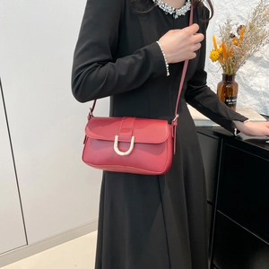Classic red leather crossbody bag with gold U-shaped buckle for office commuting