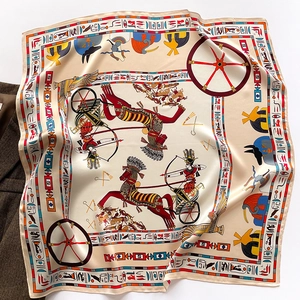 Detail of silk square scarf featuring Egyptian chariot motifs and hieroglyphic patterns