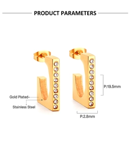 Detailed view of gold plated C-shaped stainless steel earrings with white zircon inlays