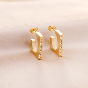 Minimalist gold C-shaped stainless steel earrings with sparkling white crystals