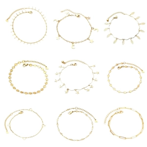 Nine gold stainless steel anklets with moon and leaf charms on a white background