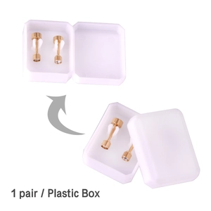 Detail of gold barbell earrings with zircon studs in a clear plastic storage box set