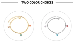 Detailed view of dual-layer anklets with enamel flowers in gold and silver finishes