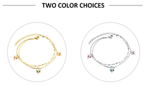 Detail view of double-layered anklet featuring colorful dragonfly pendants in gold and silver