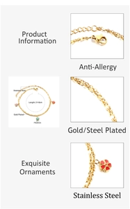 Detail of stainless steel gold anklet with colorful floral pendants and lobster clasp