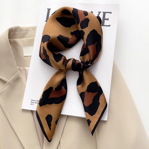 Classic leopard print mulberry silk scarf styled on a blazer for a modern look