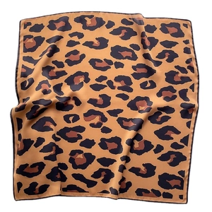 Square silk scarf featuring a classic leopard print and elegant black stitched borders