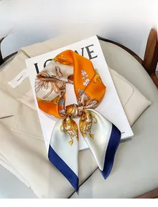 Detailed pattern of a luxury horse carriage printed on a satin silk scarf over a blazer