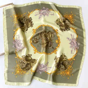 Elegant heraldic silk scarf featuring medieval shields and swords in olive green and ivory