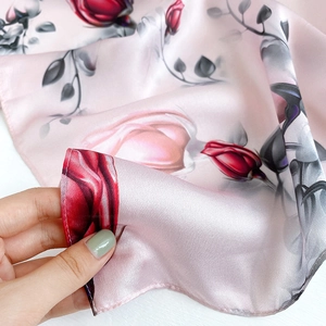 Elegant mulberry silk scarf with realistic red roses and glossy satin finish for women