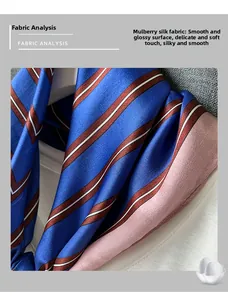 Close-up of silk scarf showing blue and brown stripes with smooth satin texture