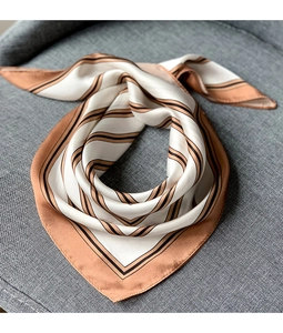 Detailed view of striped silk scarf with elegant brown and cream satin texture
