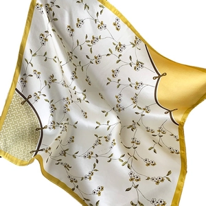 Floral print satin neck scarf in yellow and white featuring elegant vine patterns