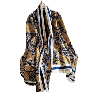 Blue and gold paisley pattern faux silk scarf shawl in long elegant drape style